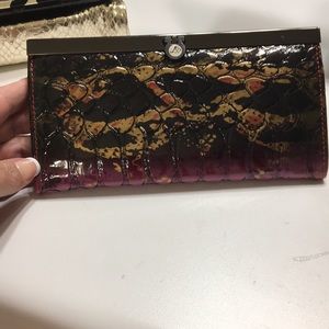 Pretty gold, burgundy, black wallet.